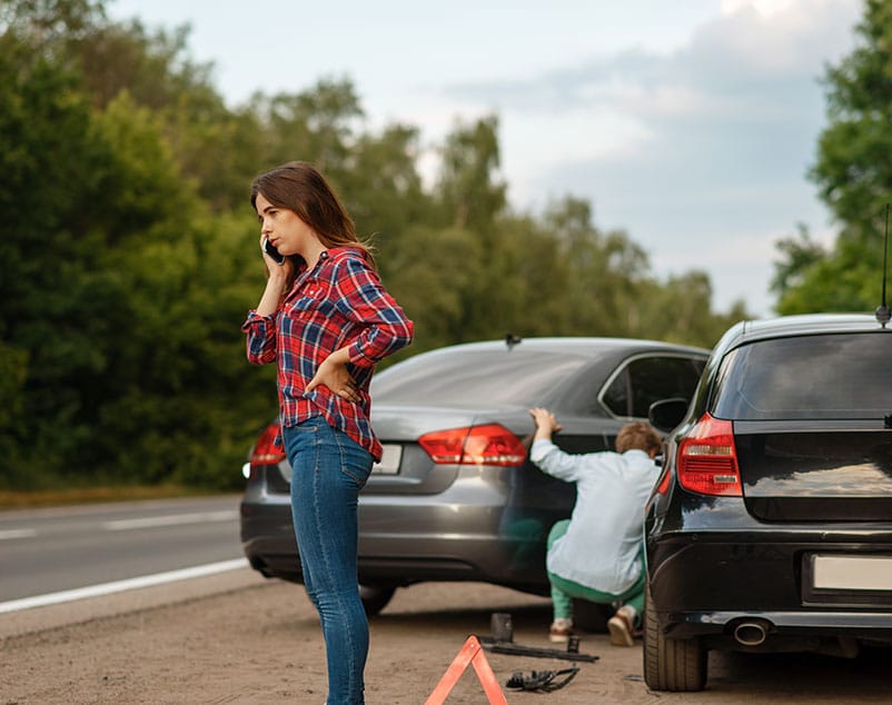 Male And Female Drivers On Road Car Accident